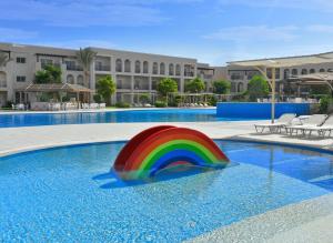 a rainbow colored ball in a swimming pool at JAZ Mirabel Resort in Sharm El Sheikh
