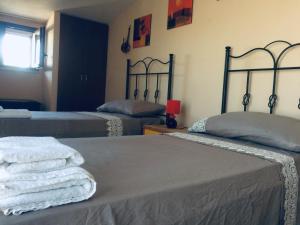 A bed or beds in a room at Ambrosia