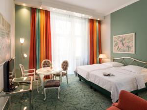 TV a/nebo společenská místnost v ubytování Hotel Palmenhof