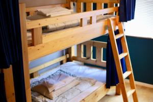 Postel nebo postele na pokoji v ubytování Greenwood Hostel