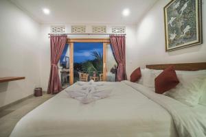 Jero Griya Ubud客房内的一张或多张床位