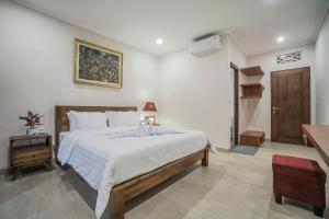 Jero Griya Ubud客房内的一张或多张床位