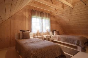 Postel nebo postele na pokoji v ubytování Villa Bumba
