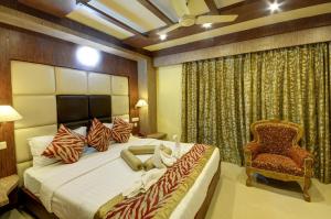 Ένα ή περισσότερα κρεβάτια σε δωμάτιο στο Hotel Sidharth