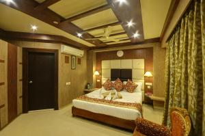 Ένα ή περισσότερα κρεβάτια σε δωμάτιο στο Hotel Sidharth