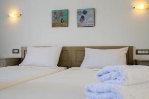 Posteľ alebo postele v izbe v ubytovaní Pontoria Stegna Studios
