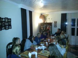 a group of people sitting at a table at Ecole Lodge Antananarivo in Mahitsy