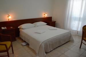 Postel nebo postele na pokoji v ubytování Castelvetere Hotel