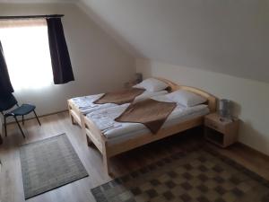 Postel nebo postele na pokoji v ubytování Grádics Panzió