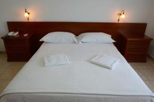 Postel nebo postele na pokoji v ubytování Castelvetere Hotel