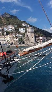 a view of the bow of a boat in the water at La Corte dei Naviganti B&B - Amalfi Coast - Cetara in Cetara