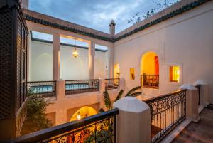 an exterior view of a house with a balcony at Riad Adilah Marrakech - by EMERALD STAY in Marrakesh