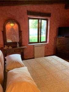 מיטה או מיטות בחדר ב-La Casa di Irene