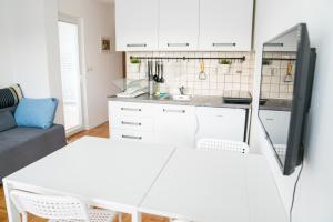 Kuchyňa alebo kuchynka v ubytovaní Apartment by Jassi