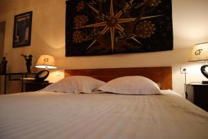 Cama o camas de una habitación en Domaine des Tilleuls