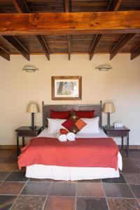 מיטה או מיטות בחדר ב-Milorho Lodge