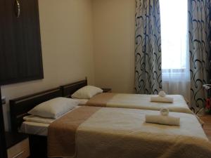 Postelja oz. postelje v sobi nastanitve Guest House Kakheti