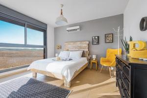 Postel nebo postele na pokoji v ubytování Mitzpush Premium Villa