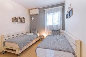 Postel nebo postele na pokoji v ubytování Mitzpush Premium Villa