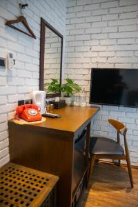 TV a/nebo společenská místnost v ubytování Carnarvon Suites By Reunion