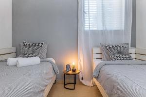 Postel nebo postele na pokoji v ubytování Mitzpush Premium Villa