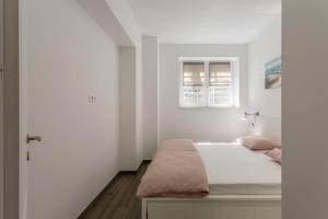 Ein Bett oder Betten in einem Zimmer der Unterkunft Apartment Lana