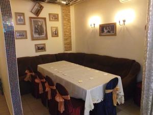 a living room with a couch with a table in it at Fiesta in Bilhorod-Dnistrovskyi