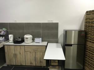 Dapur atau dapur kecil di Tuah Homestay Damai