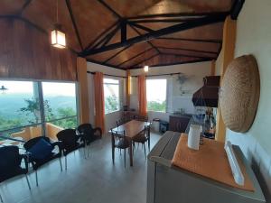 a kitchen and dining room with a table and chairs at ATT's eagles nest in Kandy +35 photos