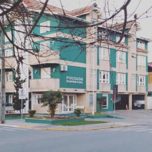 a building on the corner of a street at Pousada Ruppenthal in Canela