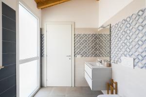 a bathroom with a sink and a toilet and a mirror at Royal Piazza di Spagna in Rome +14 photos