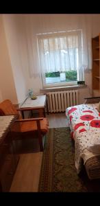 Postel nebo postele na pokoji v ubytování POKÓJ POMORSKA