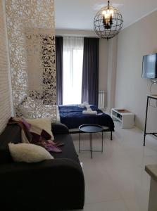 a living room with a couch and a bed in it at Tatiana Gudauri in Gudauri