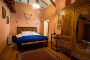 Łóżko lub łóżka w pokoju w obiekcie Posada del Puruay
