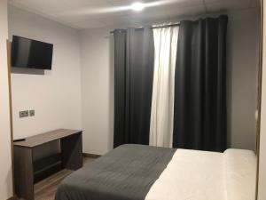 Posteľ alebo postele v izbe v ubytovaní Hostel El Paloma