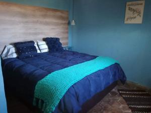Una cama o camas en una habitación de Establecimiento Rural El Chañar