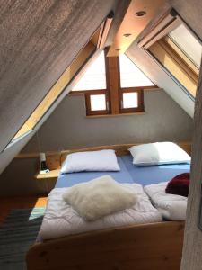 Un pat sau paturi într-o cameră la Maison Marie