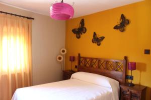 A bed or beds in a room at El Rincón Del Juez