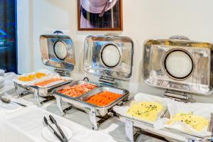 a buffet with several trays of food on a table at Ascotia Off Queen in Auckland