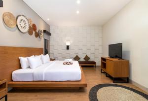 TV a/nebo společenská místnost v ubytování Annupuri Villas Bali