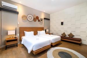 Postel nebo postele na pokoji v ubytování Annupuri Villas Bali