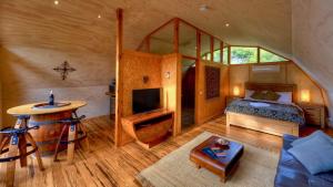 a living room filled with furniture and a fireplace at 43 Degrees Bruny Island in Adventure Bay