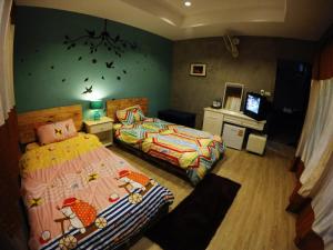 Postel nebo postele na pokoji v ubytování Payi Resort