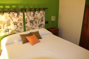 A bed or beds in a room at El Rincón Del Juez