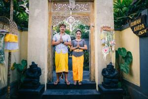 a man and a woman standing in front of a door at Rumah Karda Ubud in Ubud +22 photos