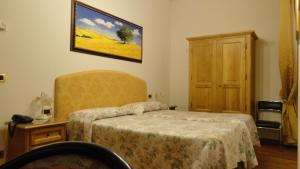 Letto o letti in una camera di Hotel La Rosa