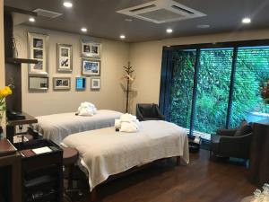 Postel nebo postele na pokoji v ubytování Hotel Mystays Premier Akasaka