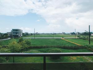 a view of a field from a balcony at Buluba in Yuanshan