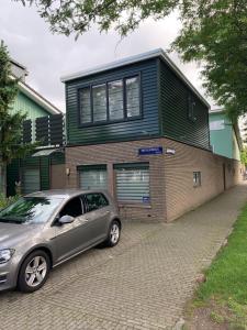 a car parked in front of a house at Hababa Short Stay in Amsterdam