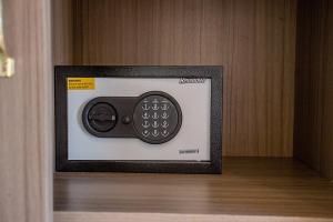 a small television with a remote control in a room at Ambengan Private Villas in Nusa Penida